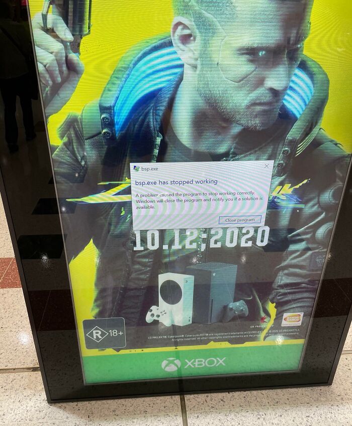 Funny ad fail showing error message over a video game poster, disrupting the display.