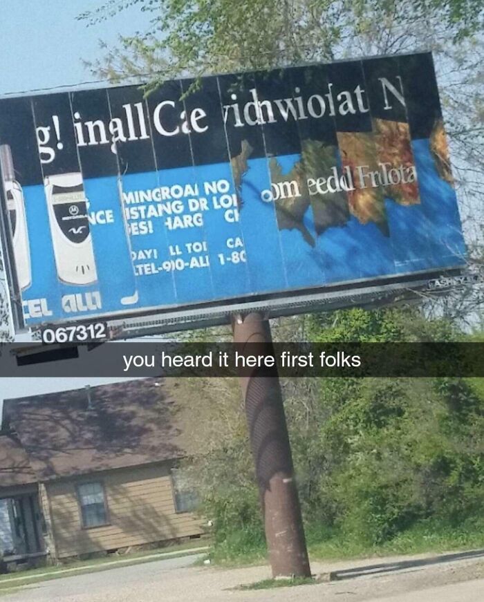 A weathered billboard with illegible text, a classic example of funny ad fails, stands in a suburban area.