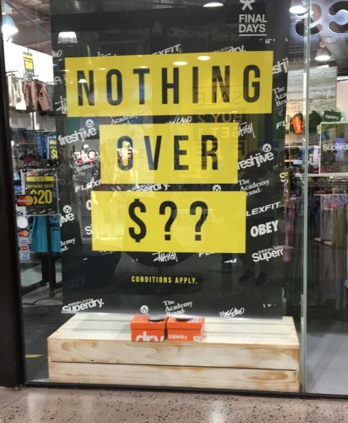 Store window with sign reading "Nothing Over $??," showcasing a funny ad fail.