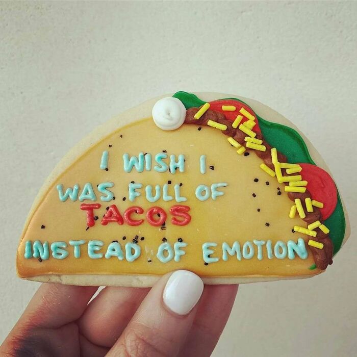 Cookie decorated like a taco with the phrase "I wish I was full of tacos instead of emotion." Women-In-Real-Life-Pics.