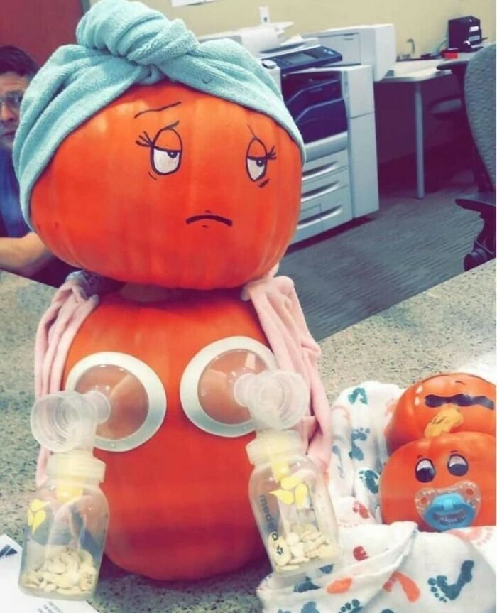 Pumpkin styled as a woman with towel, breast pump setup, and baby pumpkins, depicting a humorous take on real-life moments.