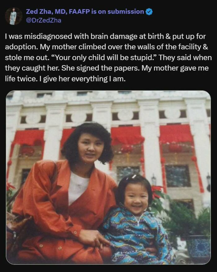 Mother and daughter smiling in front of a building, showcasing an uplifting story of resilience and love.