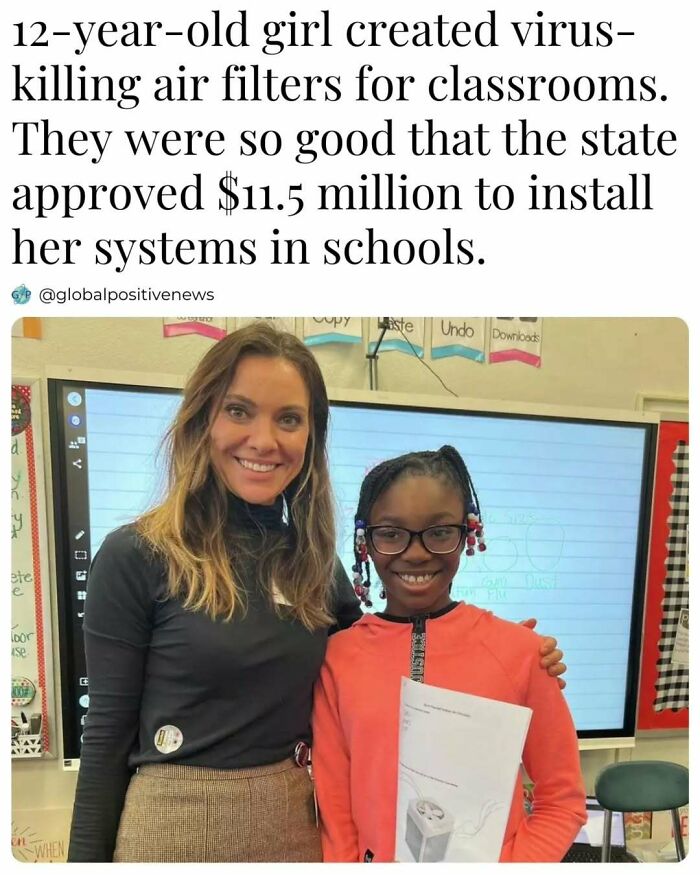 12-year-old inventor of virus-killing air filters for schools, standing in a classroom, smiling beside a woman.