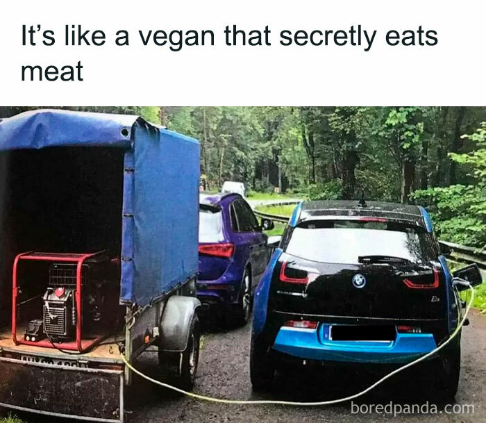 An E meme with electric car humor: car charging from a generator, caption reads "It's like a vegan that secretly eats meat."