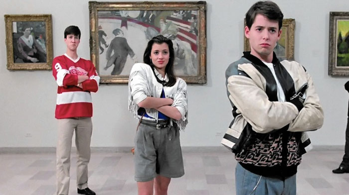 A famous trio from Ferris Bueller's Day Off, featuring Ferris Bueller, Sloane, and Cameron standing in an art museum with crossed arms and confident expressions.