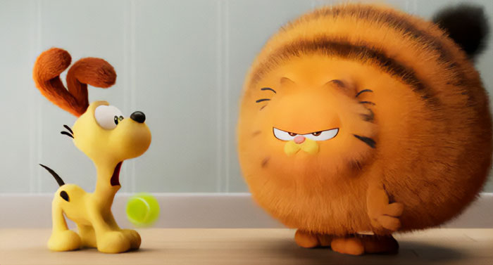 A fat cartoon character, Garfield, with a round, puffy body and grumpy expression, stands beside a shocked dog, Odie, with a tennis ball nearby.