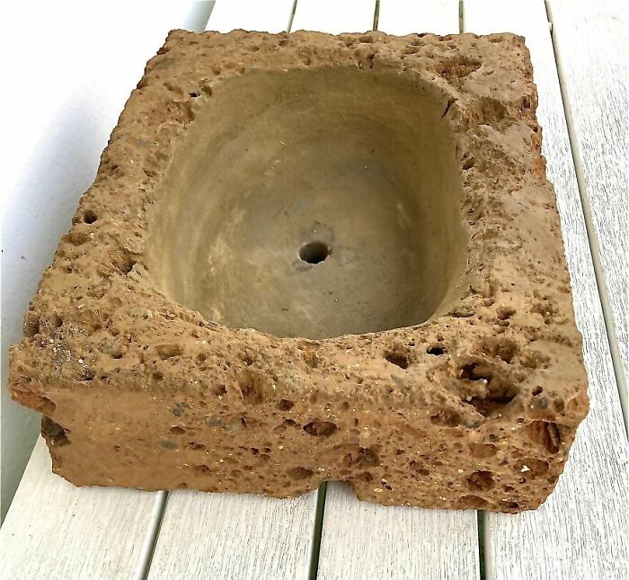 A Bathroom Sink Made Of Carved Limestone