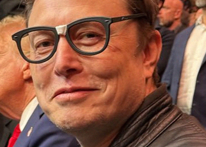 Man wearing unique glasses and a leather jacket at an event, aligning with accurate gut feelings theme.