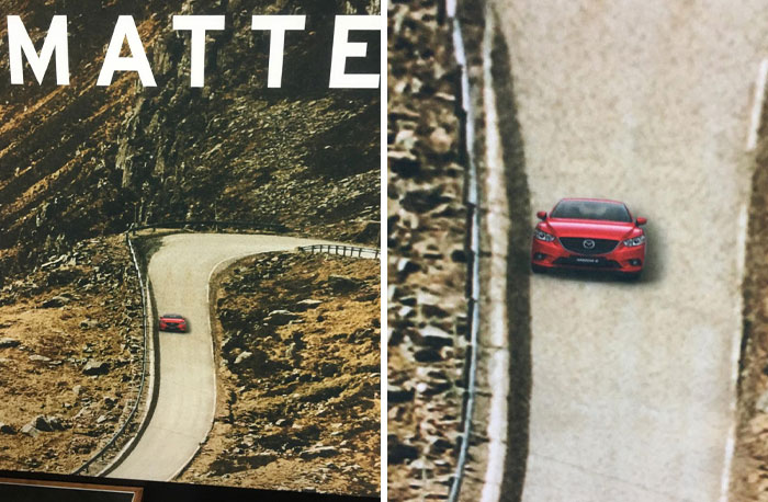 Red car on a scenic mountain road, showcasing a humorous advertising fail.