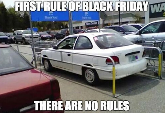 Car parked in a cart return area with funny Black Friday meme text about no rules in a parking lot.