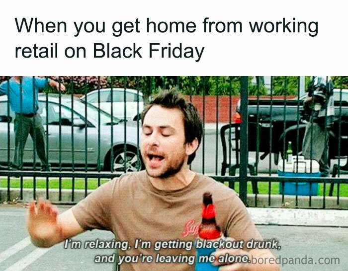 Man holding a beer bottle humorously reacting to working retail on Black Friday.