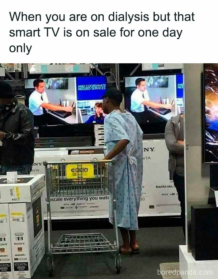 Shopper in hospital gown looking at Smart TV on Black Friday sale, humorously highlighting urgency of deal.