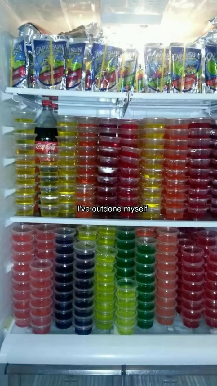 Colorful fridge filled with stacked Jello and Capri Sun, embodying the essence of 'dude fridges'.