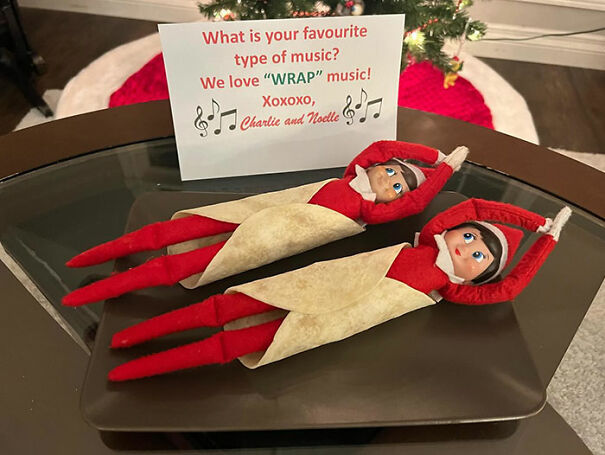 "Elf On The Shelf idea featuring two elves wrapped in tortillas on a tray with a note saying they love 'wrap' music, creating a humorous scene."