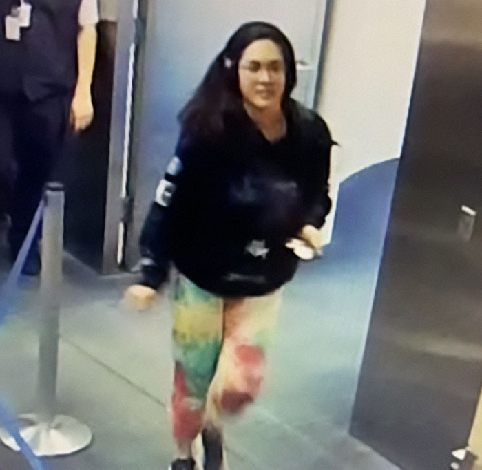 Hannah Kobayashi at the airport captured on CCTV, related to the missing person case involving mysterious payments.