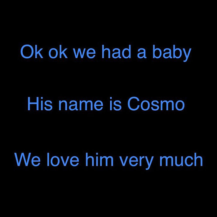 A black background with blue text reading, "Ok ok we had a baby. His name is Cosmo. We love him very much," referencing Colin Jost and Scarlett Johansson.