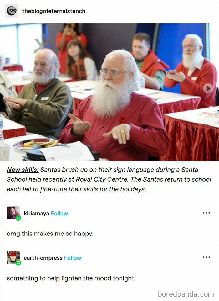 Santas in a classroom learning sign language, enhancing holiday skills, creating a wholesome and uplifting atmosphere.