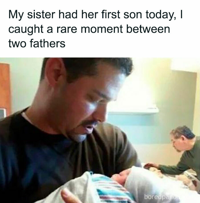 Two fathers share a tender moment with a newborn baby in a hospital setting, embodying wholesome joy.