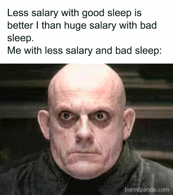 Bald man with tired eyes as a work meme depicting fatigue with less salary and bad sleep.