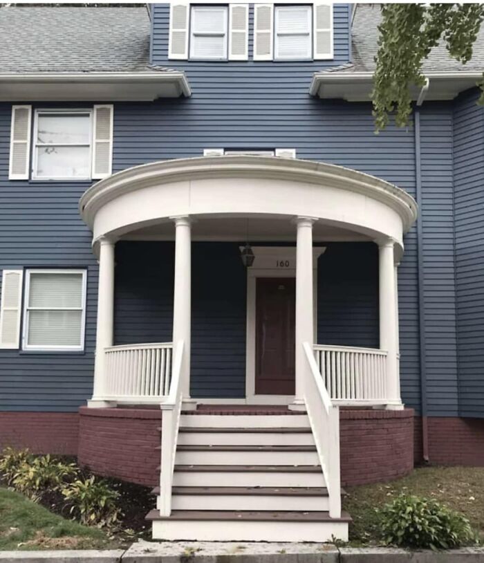 Funny cheap construction fail with porch stairs leading to a wall.