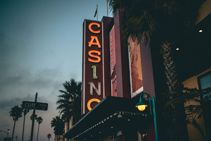 Casino sign at sunset, highlighting the importance of security measures in public spaces.