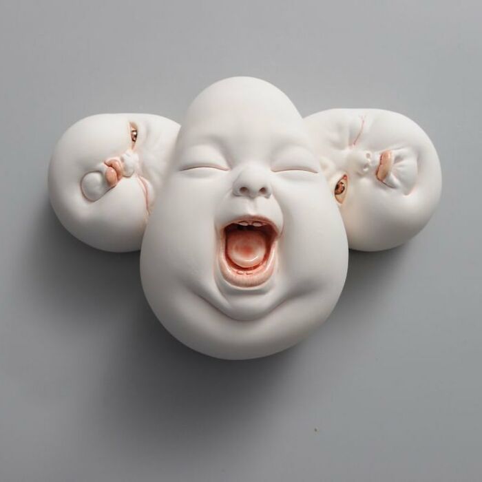 Surreal sculpture of a laughing face blending realism and imagination, featuring expressive artistic detail.