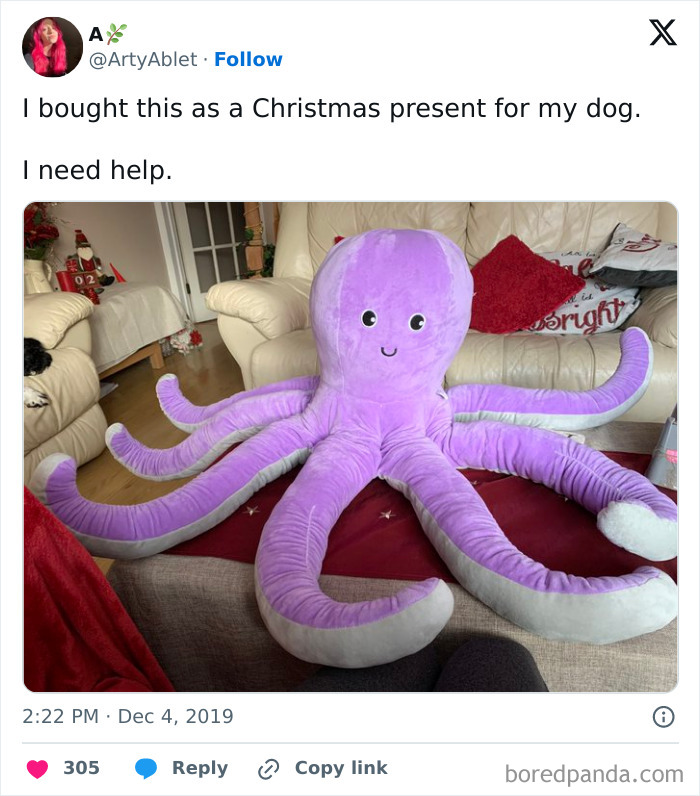 A giant purple octopus plush toy on a sofa, bought as a Christmas gift for a spoiled pet dog.