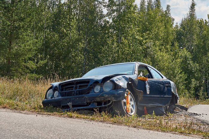 Damaged car on roadside, representing a terrible Christmas incident.