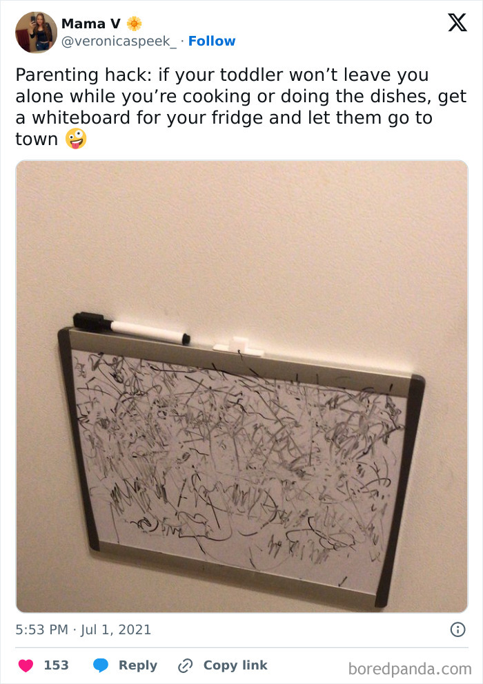 Toddler art on a fridge whiteboard showcasing a clever parenting trick.