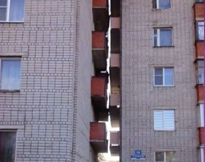 Construction fail showing two misaligned apartment buildings with a gap in between.