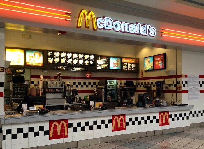 Empty McDonald's counter illustrating sudden job loss.