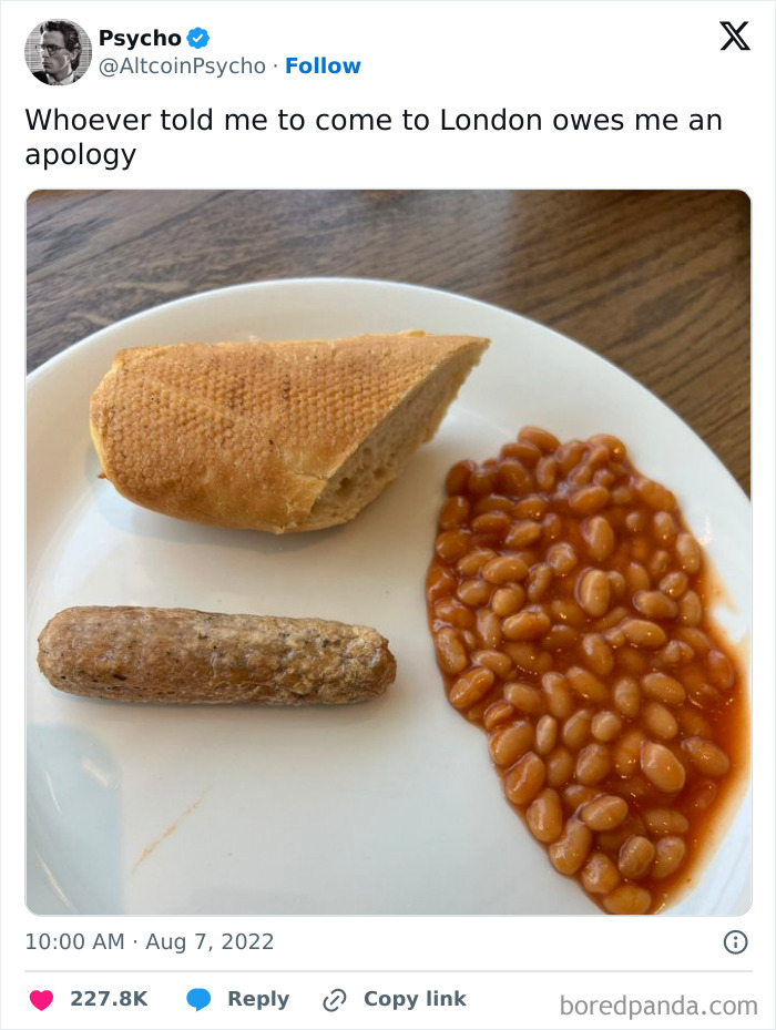 Strange dish with a baguette, sausage, and beans on a plate.