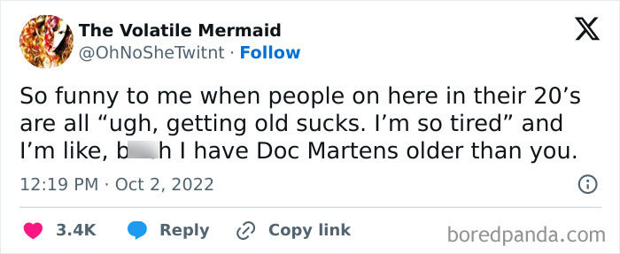 Tweet by The Volatile Mermaid humorously expressing thoughts on being an adult and aging, referencing worn Doc Martens.