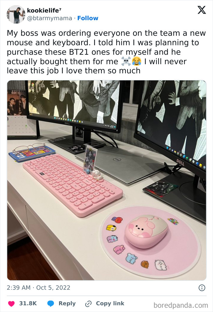 Pink BT21 keyboard and mouse on a desk, gifted by a humorous boss.