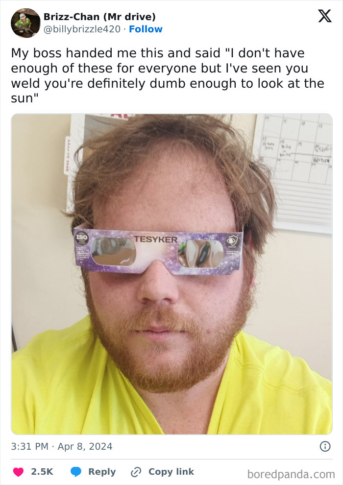 Man wearing eclipse glasses indoors, shared by good-funny-bosses.