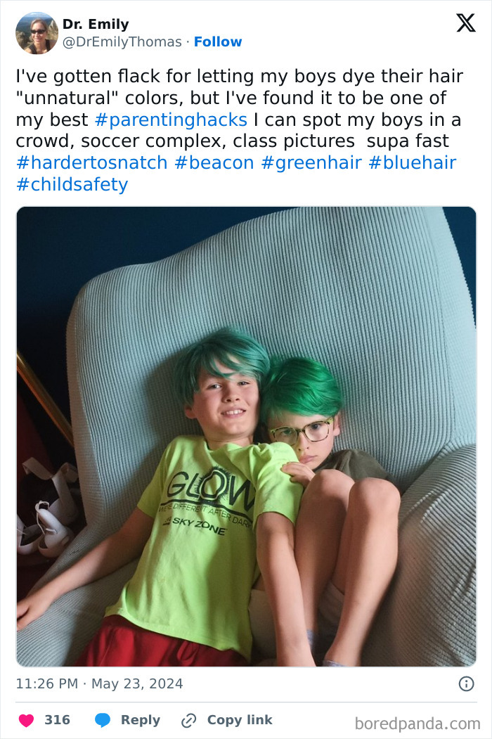 Two boys with bright green hair sitting on a chair, showcasing creative parenting tricks.