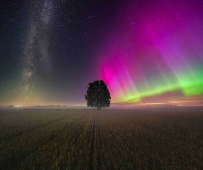 “When The Aurora Meets The Milky Way” – Jānis Paļulis