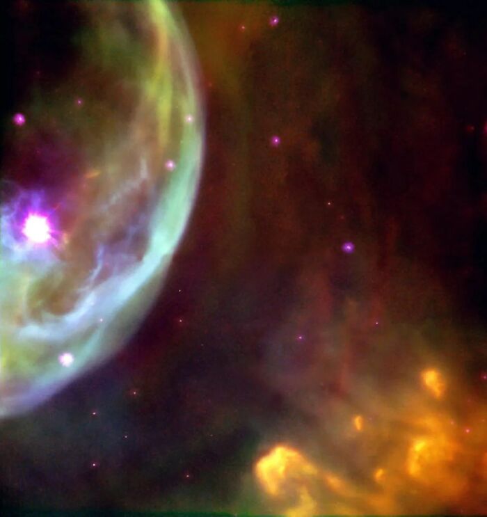 Colorful nebula with glowing stars and swirling gases, showcasing amazing cosmic beauty.