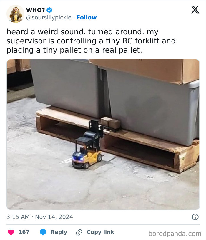 A tiny RC forklift on a warehouse floor lifting a miniature pallet, highlighting humorous boss behavior.