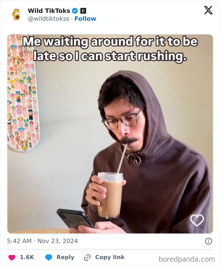 Person in a hoodie, sipping iced coffee and browsing on phone, humorously capturing TikTok moment.