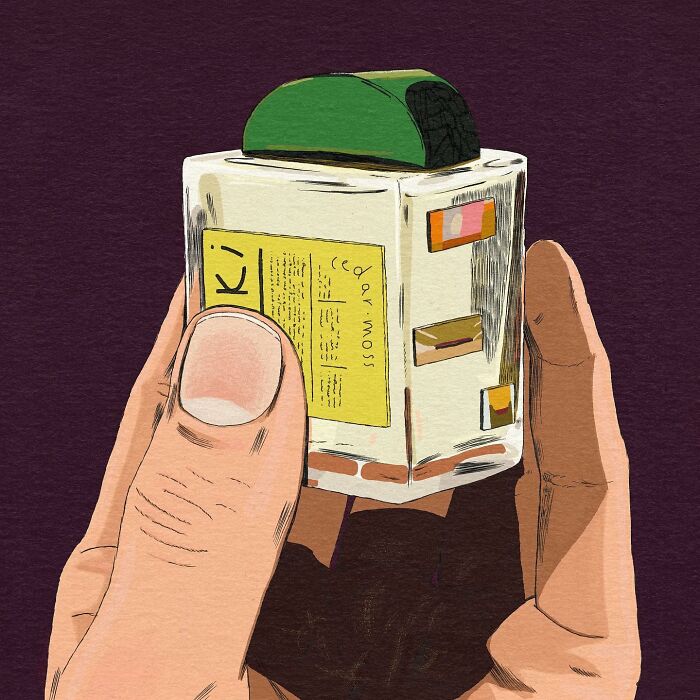 Hand holding a whimsical and surreal illustration of a cube with a green top and yellow label.