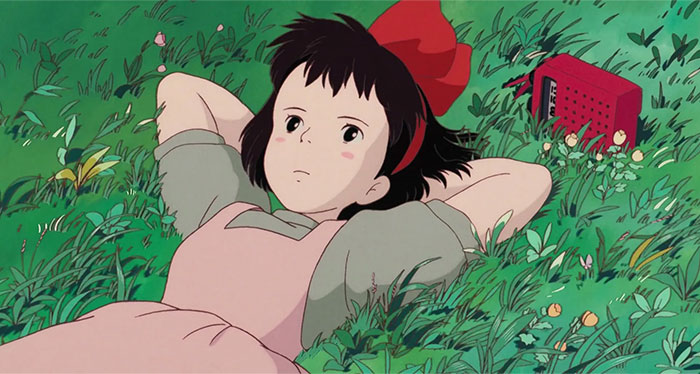 Animated girl lying in grass, strong female protagonist expression, red ribbon, radio nearby.