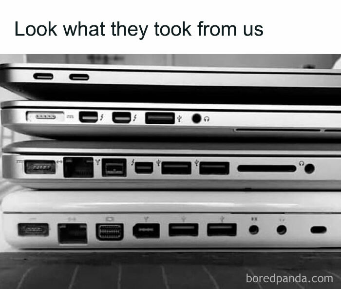 Stack of laptops showing different port configurations, highlighting changes in IT design over time.