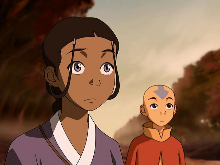 Animated scene with a strong female protagonist looking determined, accompanied by a young ally in the background.