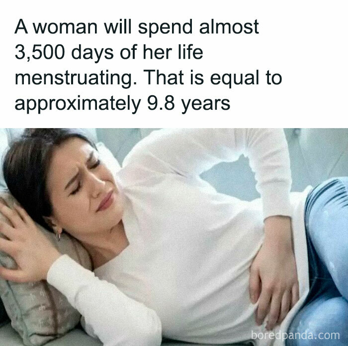 Woman in discomfort, lying on a couch, highlighting an undiscovered fact about menstruation duration in a lifetime.