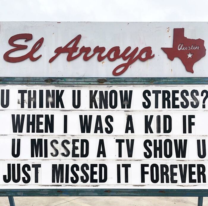 El Arroyo sign with a humorous message about missing TV shows in childhood, capturing the best sign moments.