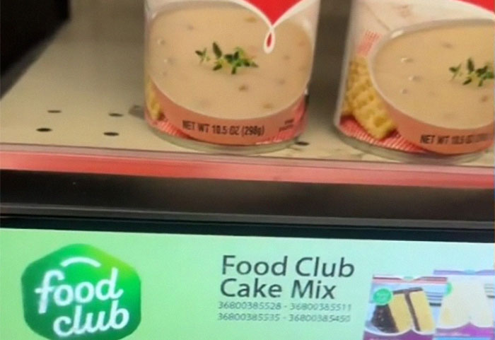 Retail display showing mismatched label of Food Club Cake Mix under soup cans.