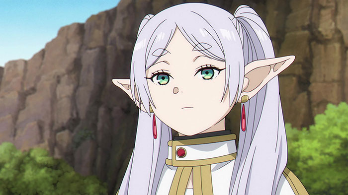 Anime character with long silver hair and elf-like ears in a mountainous landscape, representing a strong female protagonist.