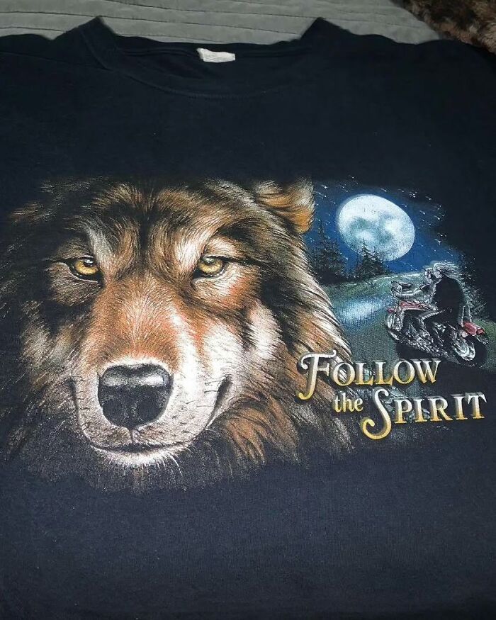 Weird shirt with a wolf face and motorcycle scene, text "Follow the Spirit," showcasing a weird design.