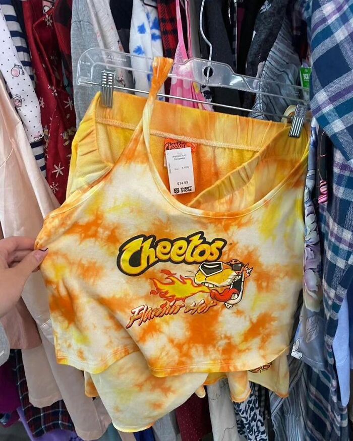 Weird shirt with Cheetos Flamin' Hot design. 